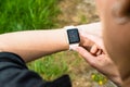 Woman checking her Apple Watch Royalty Free Stock Photo