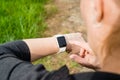 Woman checking her Apple Watch while walking Royalty Free Stock Photo