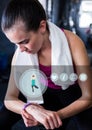 Woman checking her fitness band in gym Royalty Free Stock Photo