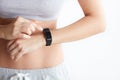 Woman checking her health tracking wearable device Royalty Free Stock Photo