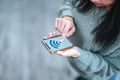 Woman is checking her smartphone for social media, shopping or chatting etc. Screen mockup concept. Royalty Free Stock Photo