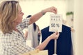 Woman checking out discounted clothes Royalty Free Stock Photo