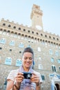 Woman checking photos in front of palazzo vecchio Royalty Free Stock Photo