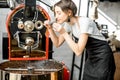 Woman roasting coffee beans Royalty Free Stock Photo