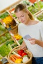 Woman checking shopping list Royalty Free Stock Photo