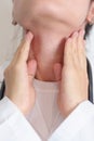 Woman checking Thyroid gland disease. Hand holding Neck pain. Hyperthyroidism, Hypothyroidism, Hashimoto Thyroiditis, Thyroid Royalty Free Stock Photo