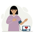 Woman checks blood pressure. healthcare concept. Blood pressure measurement, digital tonometer. Health monitoring.