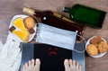 Woman checks her weight after quarantine. Sad smile on balance screen. Concept of unhealthy lifestyle during self-isolation