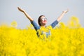 Woman cheering in the field Royalty Free Stock Photo