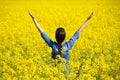 Woman cheering in the field Royalty Free Stock Photo