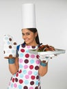 Woman chef with baked chicken