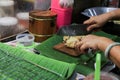 A woman Chef cutting sliced tofu on wooden chopping board, selective focused of food made from soybeans in traditional Chinese sty