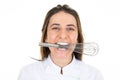 Woman chef funny happy with a mixer hand in her mouth on white background