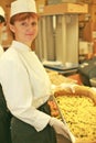 A woman chef is holding a tray Royalty Free Stock Photo