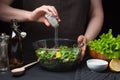 Woman chef in the kitchen preparing vegetable salad. Healthy Eating. Diet Concept. A Healthy Way Of Life. To Cook At Royalty Free Stock Photo