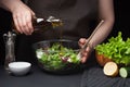 Woman chef in the kitchen preparing vegetable salad. Healthy Eating. Diet Concept. A Healthy Way Of Life. To Cook At Home. The gir Royalty Free Stock Photo