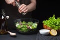 Woman chef in the kitchen preparing vegetable salad. Healthy Eating. Diet Concept. A Healthy Way Of Life. To Cook At Royalty Free Stock Photo