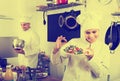 Woman chef serving fresh salad Royalty Free Stock Photo