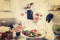Woman chef serving fresh salad Royalty Free Stock Photo
