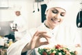 Woman chef serving fresh salad Royalty Free Stock Photo