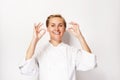 Woman chef showing sign perfect both hands over whita background Royalty Free Stock Photo