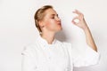 Woman chef showing sign perfect both hands over whita background Royalty Free Stock Photo