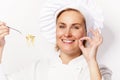 Woman chef showing a sign perfect, with pasta noodle on fork, ov Royalty Free Stock Photo