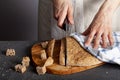 A woman chef is slicing fresh baked homemade Turkish Flat bread known as pide Royalty Free Stock Photo