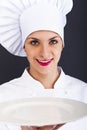 Woman cheff over dark backgrund Royalty Free Stock Photo