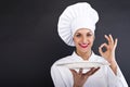 Woman cheff over dark backgrund Royalty Free Stock Photo