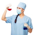 Woman chemist with colored flasks in their hands