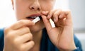 Woman Chewing Wet Moist Nicotine Product