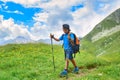 Child during alpine trekking in summer