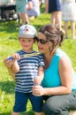 Woman and child blowing soap bubbles Royalty Free Stock Photo