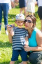 Woman and child blowing soap bubbles Royalty Free Stock Photo