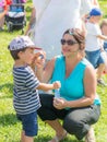 Woman and child blowing soap bubbles Royalty Free Stock Photo