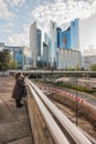 A woman with a child in the business district of Paris