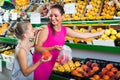 woman with child buying fruits Royalty Free Stock Photo
