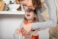 Woman and child cooking and laughing