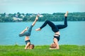 Woman and child doing handstand exercise Royalty Free Stock Photo