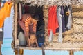 Woman and child in doorway of traditional home