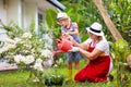 Woman and child gardening. Grandmother and kid