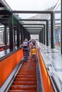 Duisburg, Germany - July 16, 2021: a woman with a child going up on an escalator