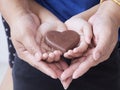 Woman and child holding chocolate heart Royalty Free Stock Photo