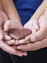 Woman and child holding chocolate heart Royalty Free Stock Photo