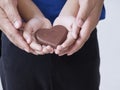 Woman and child holding chocolate heart Royalty Free Stock Photo