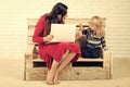 Woman and child with laptop, inclusive education. Royalty Free Stock Photo
