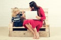 Woman and child with laptop, inclusive education. Royalty Free Stock Photo