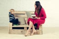 Woman and child with laptop, inclusive education. Royalty Free Stock Photo