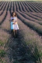 woman and child in lavender in purple flowers walk nature journey